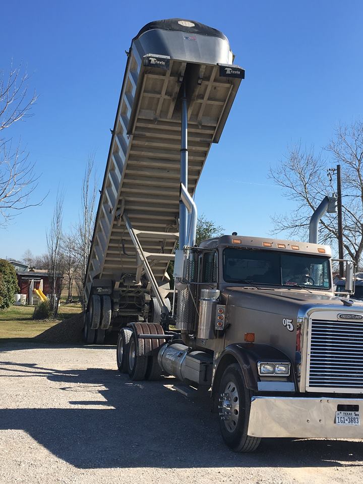 Dumping flex base at the yard to expand parking area.