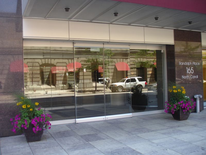 All glass automatic sliding doors at entrance to condominium building