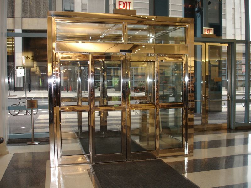 Polished stainless steel clad automatic sliding doors 