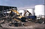 Controlled Demolition of a Three Story Warehouse in an Active Fuel Storage Terminal