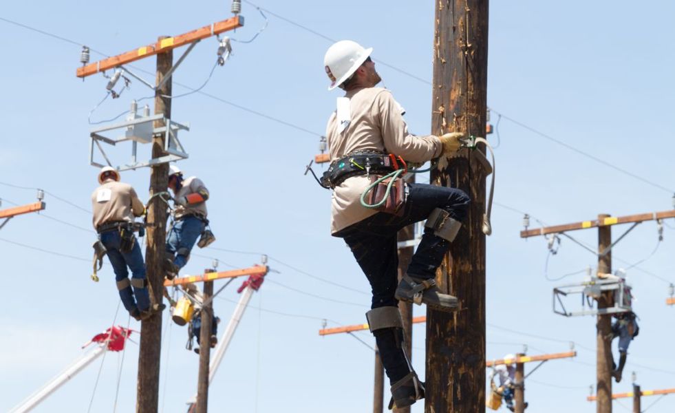 Pole climbing at the NCC Employer Day event.