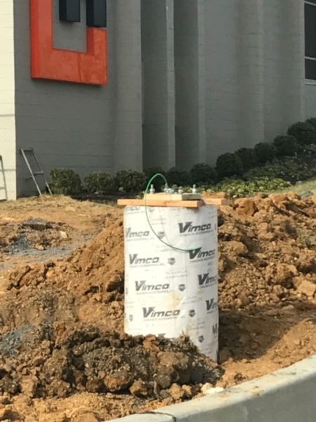 Poured concrete sonotube for parking lot lights 